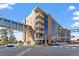Contemporary building exterior with multiple balconies, glass windows, and a skybridge at 2410 Environ Way, Chapel Hill, NC 27517
