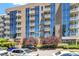 Building exterior with balconies surrounded by beautiful green trees at 2410 Environ Way, Chapel Hill, NC 27517