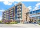 Modern building exterior with private balconies, pedestrian bridge and attractive landscaping at 2410 Environ Way, Chapel Hill, NC 27517