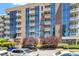 Building exterior with balconies surrounded by beautiful green trees at 2410 Environ Way, Chapel Hill, NC 27517
