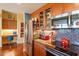 This gourmet kitchen features granite counters and stainless steel appliances and custom cabinets at 2410 Environ Way, Chapel Hill, NC 27517