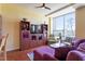 Comfortable living room with hardwood floors, large window views and entertainment center at 2410 Environ Way, Chapel Hill, NC 27517