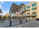 Exterior view of outdoor lounge and dining area under large awning structure in modern building at 2410 Environ Way, Chapel Hill, NC 27517