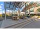 Relaxing outdoor lounge with dining and seating areas under a modern awning structure at 2410 Environ Way, Chapel Hill, NC 27517