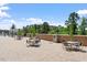 Outdoor seating on a brick-paved terrace with green umbrellas for shade at 2410 Environ Way, Chapel Hill, NC 27517