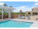 A shared outdoor pool, featuring lounge chairs and well-maintained landscaping at 2410 Environ Way, Chapel Hill, NC 27517