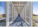 Bright skywalk hallway with glass walls connecting two buildings and views to the outside at 2410 Environ Way, Chapel Hill, NC 27517
