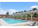 Inviting outdoor swimming pool with lounge chairs and shaded seating areas, perfect for relaxation at 2410 Environ Way, Chapel Hill, NC 27517
