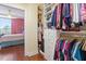 Walk-in closet with custom shelving, hanging rods, and access to the main bedroom at 2410 Environ Way, Chapel Hill, NC 27517