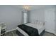 Cozy bedroom with a ceiling fan, a decorative window, and an adjacent closet door at 2412 Chartwell Ln, Graham, NC 27253