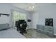 This is a spacious bedroom with desk, a window view, and plenty of natural light at 2412 Chartwell Ln, Graham, NC 27253