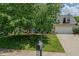 Well-maintained two-story home with an attached garage and a lush green lawn in a desirable neighborhood at 2412 Chartwell Ln, Graham, NC 27253