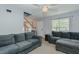 Inviting living room featuring neutral colors, staircase, and comfortable seating, perfect for relaxation and gatherings at 2412 Chartwell Ln, Graham, NC 27253