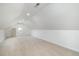 Unfinished attic space with natural light, a blank canvas for storage or expansion at 2421 Beckwith Rd, Apex, NC 27523