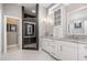 Bathroom showcasing a double vanity with granite countertops and a modern glass-enclosed shower with decorative tile at 2421 Beckwith Rd, Apex, NC 27523