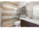 Bathroom features a glass-enclosed shower, granite counters, and a modern vanity at 2421 Beckwith Rd, Apex, NC 27523