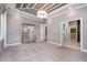 Large bedroom boasting tray ceiling, chandelier lighting, and a large mirror reflecting natural light at 2421 Beckwith Rd, Apex, NC 27523
