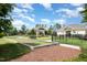 Community bocce ball court and picnic area with manicured lawns and landscaping at 2421 Beckwith Rd, Apex, NC 27523