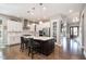 Spacious kitchen with a center island, stainless steel appliances, and hardwood floors at 2421 Beckwith Rd, Apex, NC 27523