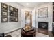 Elegant living room featuring a fireplace, sophisticated decor, and hardwood flooring at 2421 Beckwith Rd, Apex, NC 27523