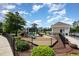 Community playground with slides and various equipment surrounded by manicured landscaping at 2421 Beckwith Rd, Apex, NC 27523