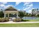 Community tennis courts nestled among trees and lush landscaping at 2421 Beckwith Rd, Apex, NC 27523