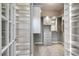 Well-organized walk-in closet featuring custom shelving, drawers, and ample storage space at 2421 Beckwith Rd, Apex, NC 27523