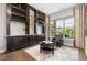 Cozy wine room with custom shelving and a comfortable seating area, perfect for entertaining and relaxation at 2421 Beckwith Rd, Apex, NC 27523
