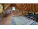 Unfinished attic space with exposed rafters, ready for customization, and brimming with potential at 260 Woody Ln, Oxford, NC 27565