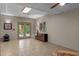Spacious finished basement with neutral flooring, a small wood stove, and outdoor access at 260 Woody Ln, Oxford, NC 27565