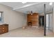 View of basement with wood-paneled wall and drop ceiling at 260 Woody Ln, Oxford, NC 27565