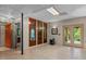 Finished basement featuring neutral flooring, decorative doors, and access to the outdoors at 260 Woody Ln, Oxford, NC 27565