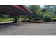 A parking shelter provides shaded parking for the vehicles at 260 Woody Ln, Oxford, NC 27565