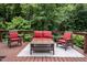 Outdoor deck with comfortable seating and wooded surroundings offering a serene escape at 260 Woody Ln, Oxford, NC 27565