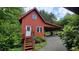 Charming exterior view with a covered parking area and steps leading to the entrance at 260 Woody Ln, Oxford, NC 27565