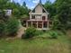Exterior home view with large back porch and mature foliage at 260 Woody Ln, Oxford, NC 27565