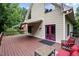 Home exterior featuring a spacious wooden deck and vibrant pink doors at 260 Woody Ln, Oxford, NC 27565