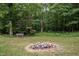Inviting backyard fire pit area with seating, perfect for gatherings and enjoying outdoor evenings at 260 Woody Ln, Oxford, NC 27565