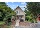 Charming home featuring a stone walkway and a cozy front porch with chairs at 260 Woody Ln, Oxford, NC 27565