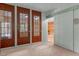 Open view of hall with glass door and access to basement at 260 Woody Ln, Oxford, NC 27565