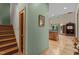 Hallway with wooden staircase that leads to the open concept floor plan with lots of light at 260 Woody Ln, Oxford, NC 27565