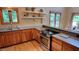 Eat in kitchen features stainless appliances, custom wood cabinets, and great views of the backyard at 260 Woody Ln, Oxford, NC 27565
