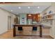 Well lit kitchen featuring stainless steel appliances, custom cabinetry and a breakfast bar at 260 Woody Ln, Oxford, NC 27565