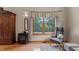 Living room with a decorative wood burning stove and views of a wooded area at 260 Woody Ln, Oxford, NC 27565