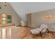 Cozy living room with hardwood floors, high ceilings, unique windows, and stylish furnishings at 260 Woody Ln, Oxford, NC 27565