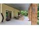 Covered patio with outdoor seating area, ideal for relaxation and enjoying the surrounding views at 260 Woody Ln, Oxford, NC 27565