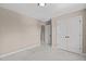 Bedroom with carpeted floor, double closet, and tan walls at 2712 Peachleaf St, Raleigh, NC 27614