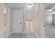 Upstairs hallway showing doors to bedrooms and stairway with window at 2712 Peachleaf St, Raleigh, NC 27614
