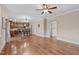 Open concept living room with hardwood floors leading to the kitchen and dining area at 2712 Peachleaf St, Raleigh, NC 27614