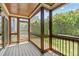 Enclosed screened porch with wood ceiling overlooking backyard at 2712 Peachleaf St, Raleigh, NC 27614
